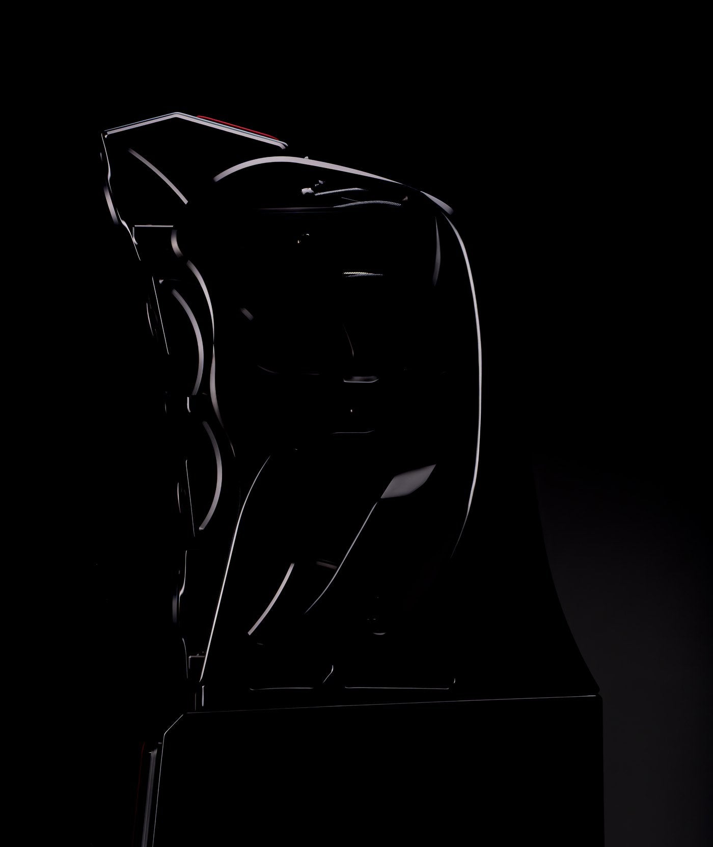 The Autobiography in New Zealand Black Sand Satin, its silhouette drawn in light against a black ground