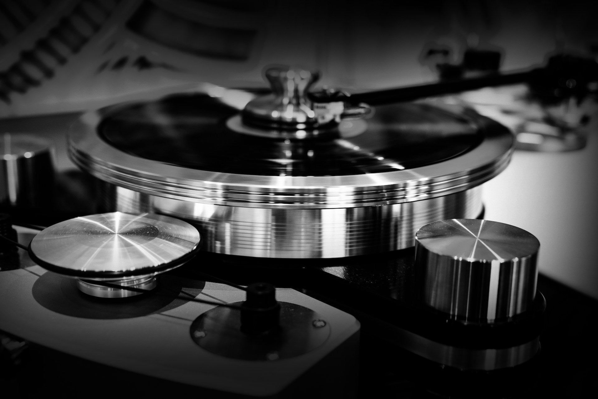 A turntable in the Sound Sanctuary Austin listening room, tonearm lowered onto a record.