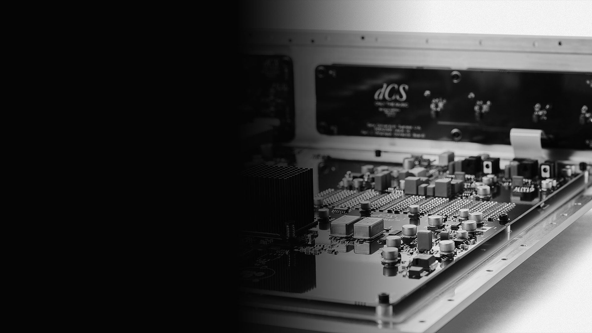 Inside a Varèse chassis — a dCS Audio circuit board over the signed rear panel